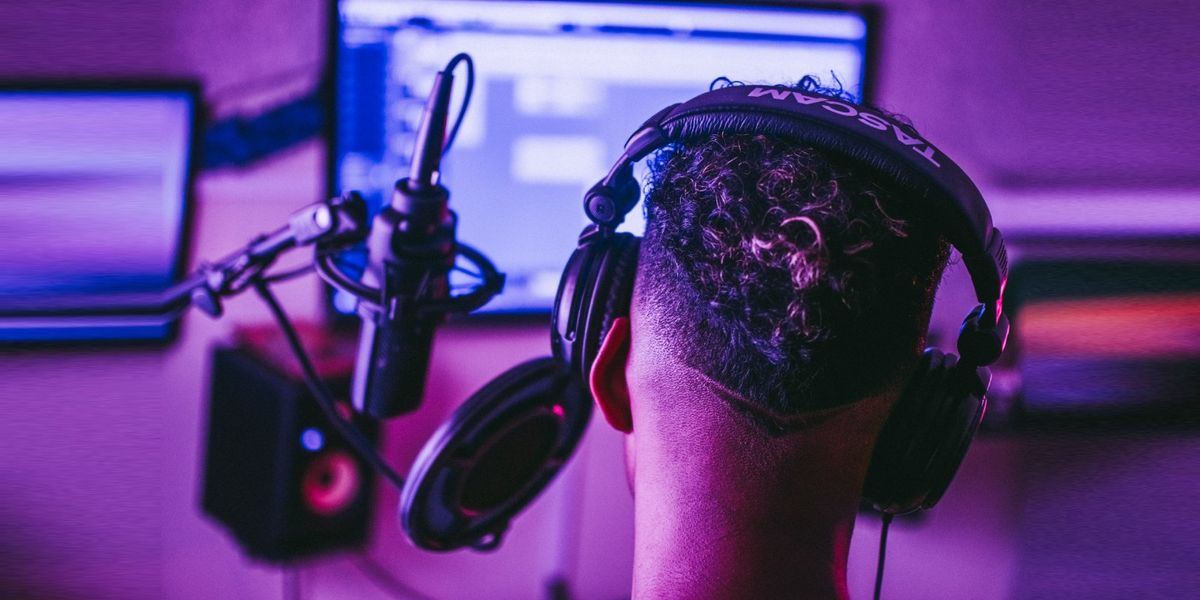 A guy producing music in his studio